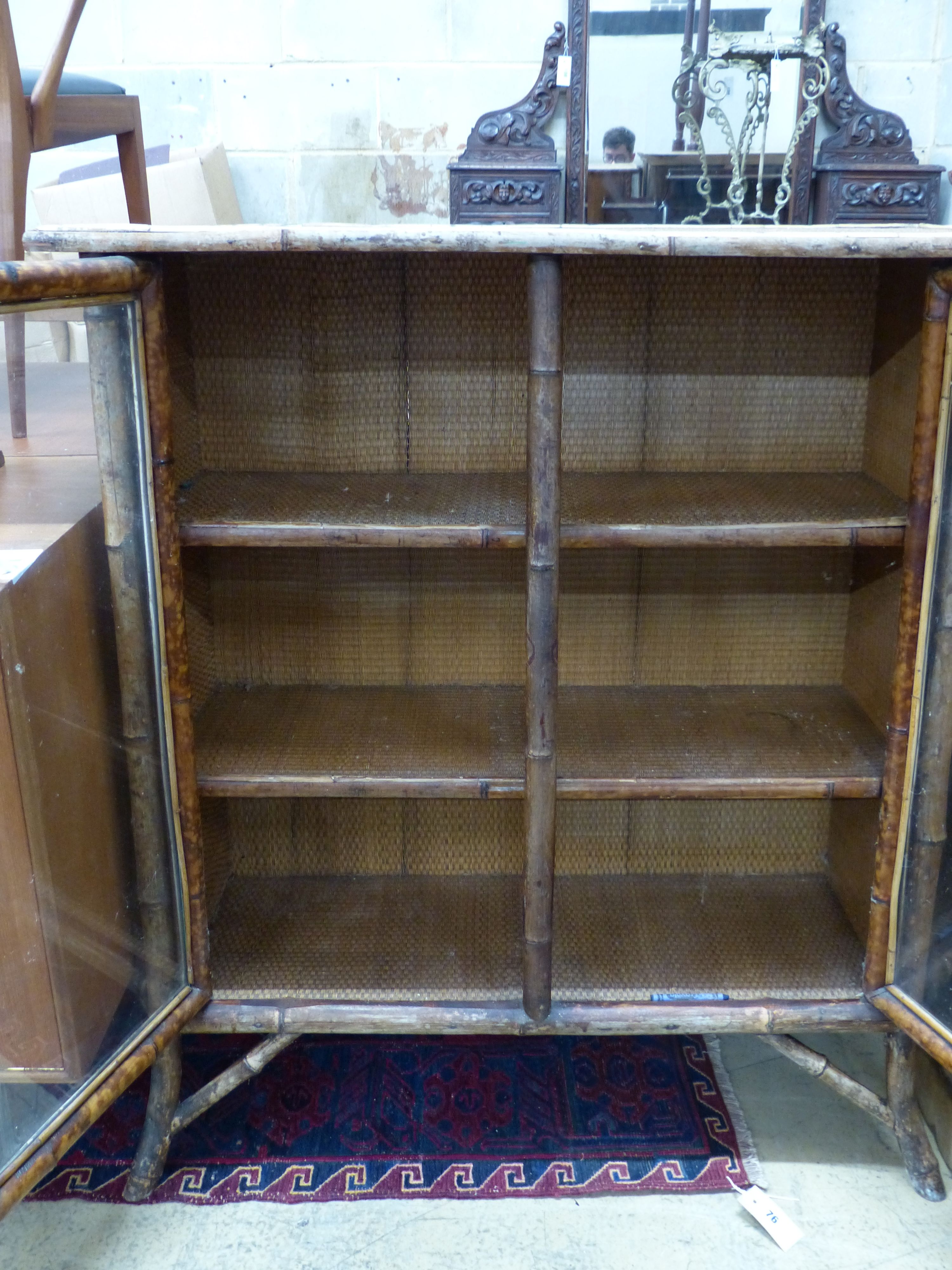 An Edwardian bamboo and cane bookcase, width 91cm